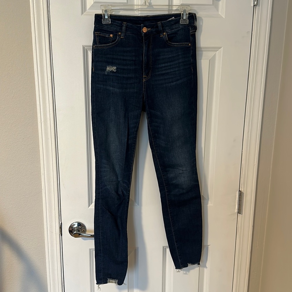 Dark denim skinny jeans from H&M w/ slight distressing & raw edges at the ankle